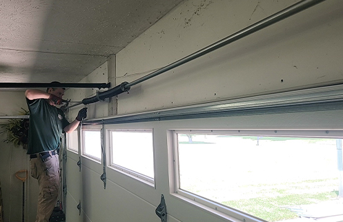 Technician Repairing Garage Door